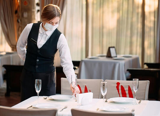 Waitress wearing mask