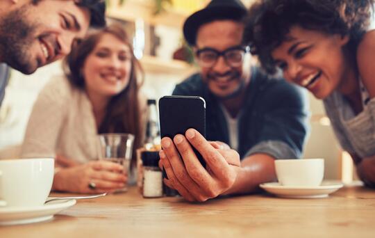 People looking at a phone