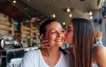 Girl kissing mum