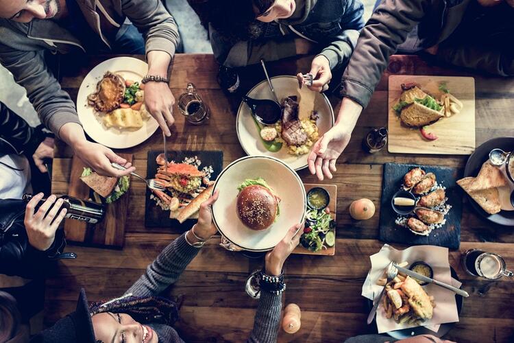 people dining at restaurant with burgers